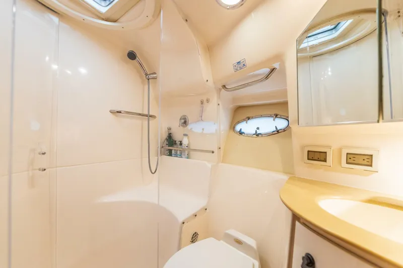 Slide: The Image of Luxurious bathroom in a 2004 Tiara Yachts 38 Express with modern fixtures. - 22