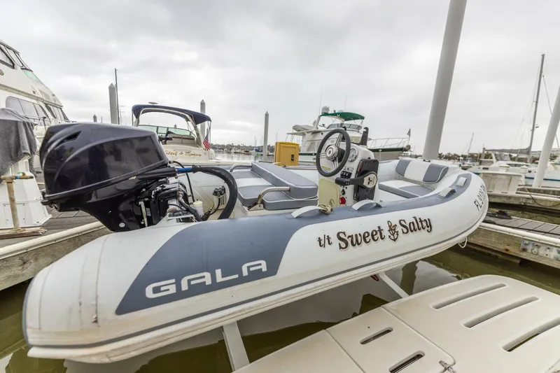 Slide: The Image of Inflatable boat Sweet & Salty docked near a 2004 Tiara Yachts 38 Express. - 29