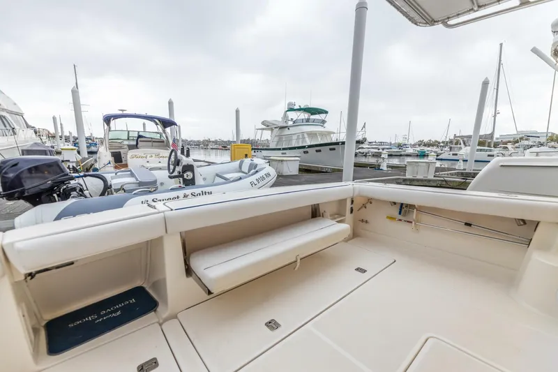 Slide: The Image of 2004 Tiara Yachts 38 Express at marina, spacious deck view. - 33