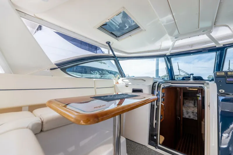 Slide: The Image of Interior of 2004 Tiara Yachts 38 Express with seating and table. - 43