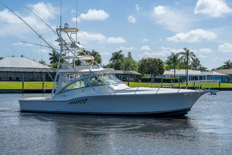 Slide: The Image of 2005 Albemarle 410 boat cruising on a sunny day. - 12