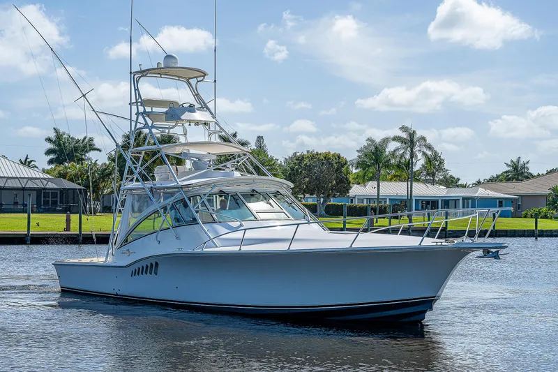 Slide: The Image of 2005 Albemarle 410 boat cruising on a sunny day. - 14