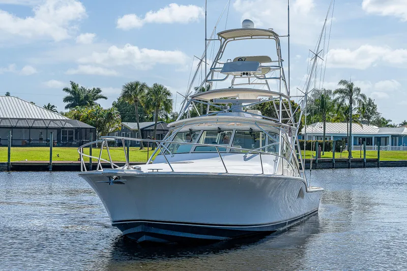 Slide: The Image of 2005 Albemarle 410 boat docked on a sunny day. - 18