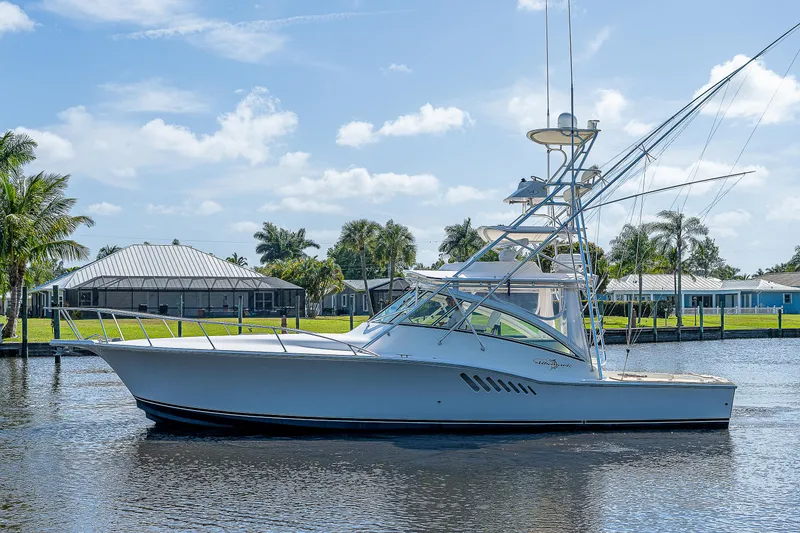 Slide: The Image of 2005 Albemarle 410 boat on calm water with a clear sky background. - 20
