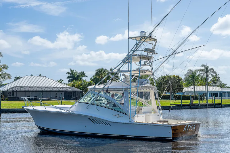 Slide: The Image of 2005 Albemarle 410 boat on a sunny day in a canal. - 23