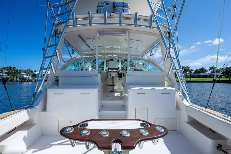 Slide: The Image of 2005 Albemarle 410 yacht cockpit with fishing rod holders and helm station. - 29