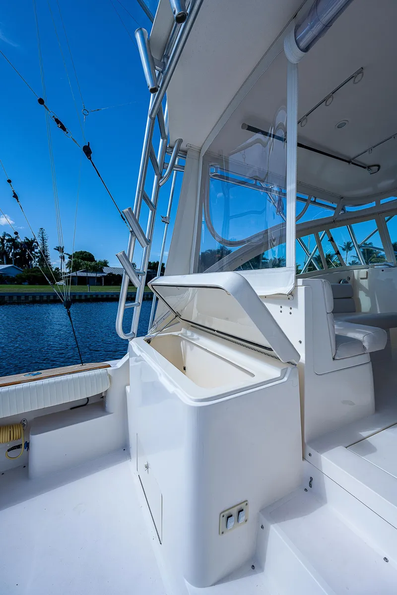 Slide: The Image of 2005 Albemarle 410 boat interior with open storage compartment. - 32