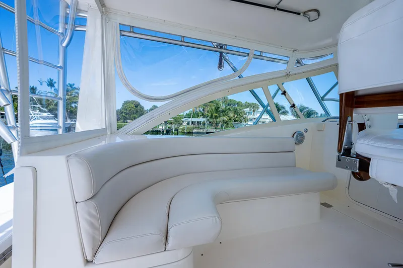 Slide: The Image of 2005 Albemarle 410 yacht interior with white leather seating and large windows. - 39