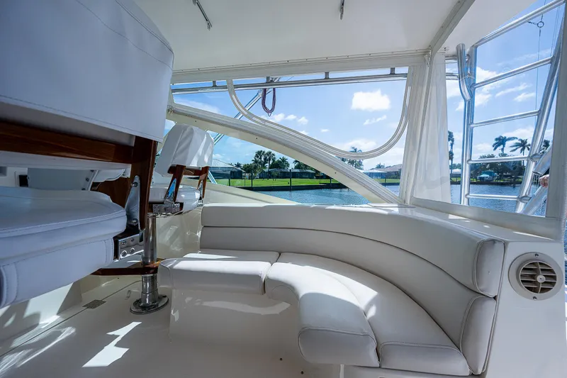 Slide: The Image of Luxurious seating area on a 2005 Albemarle 410 yacht with waterfront view. - 40