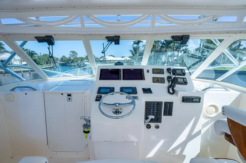 Slide: The Image of Helm of 2005 Albemarle 410 boat with steering wheel and navigation instruments. - 42