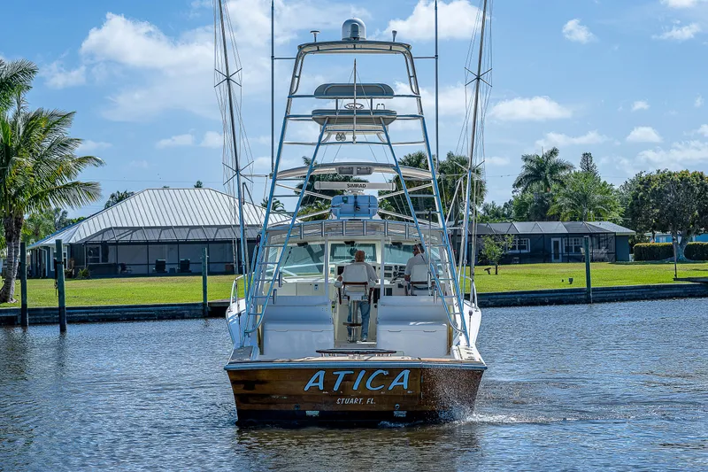Slide: The Image of 2005 Albemarle 410 boat named ATICA cruising on a sunny day. - 7