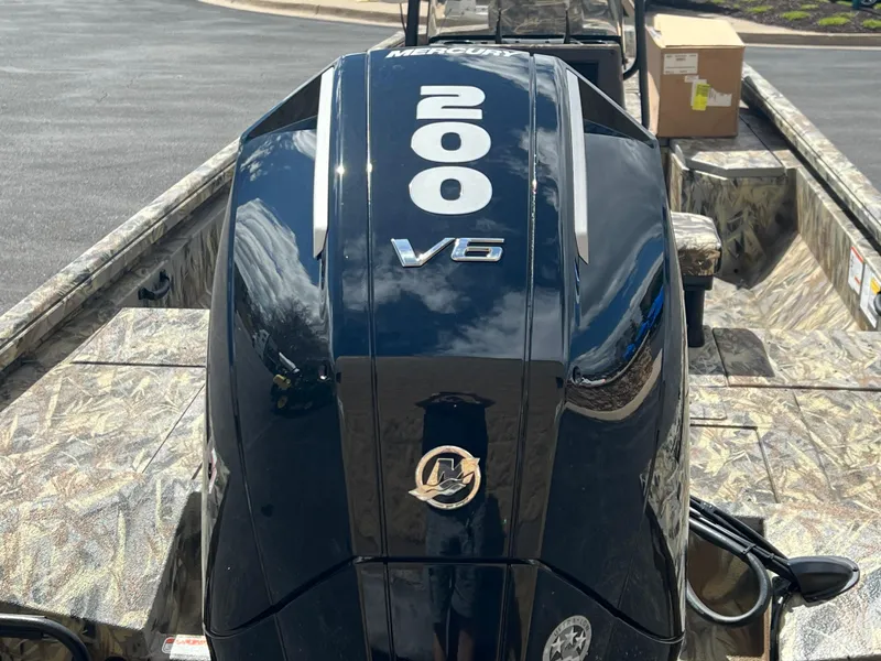 Slide: The Image of 2024 Ranger RB210 boat with a Mercury 200 V6 outboard motor. - 11