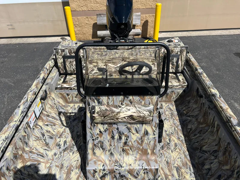 Slide: The Image of 2024 Ranger RB210 boat with camouflage interior and steering console. - 4