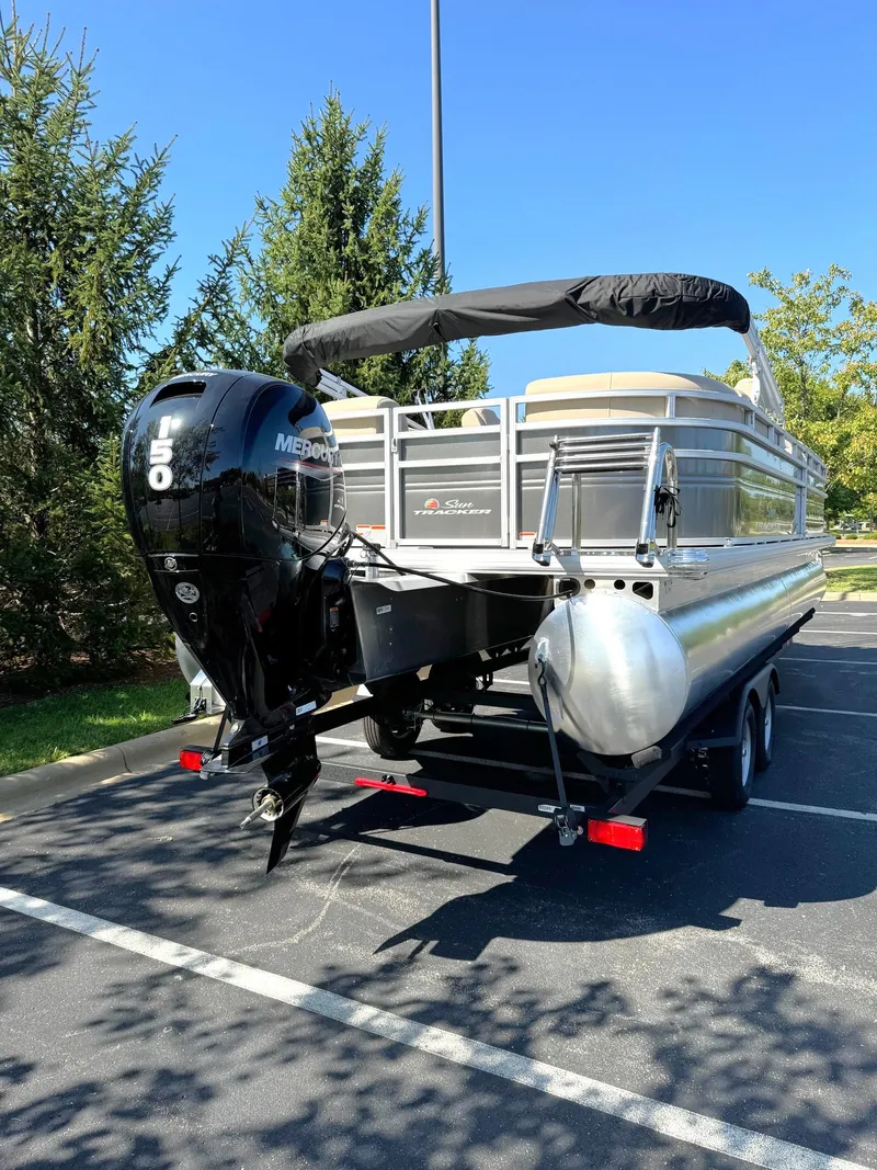 Slide: The Image of 2024 Sun Tracker Party Barge 24 DLX pontoon boat with Mercury outboard motor. - 5