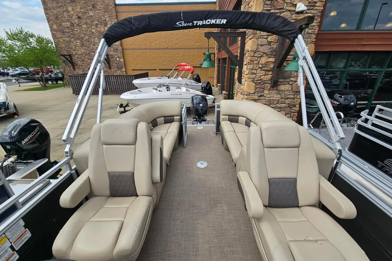 Slide: The Image of 2024 Sun Tracker Party Barge 24 DLX pontoon boat with luxurious seating and modern design. - 56