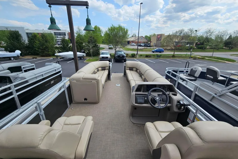 Slide: The Image of 2024 Sun Tracker Party Barge 24 DLX pontoon boat with spacious seating and modern helm. - 58