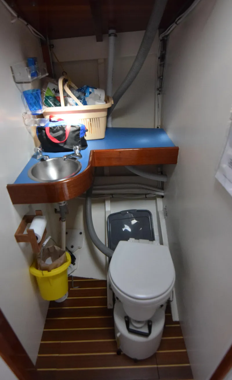 Slide: The Image of Compact bathroom in a 2000 Custom Tumbleweed/Tony Skidmore 36 Fin Keel Cutter yacht. - 20