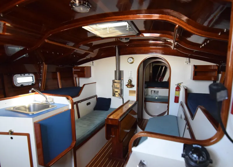 Slide: The Image of Interior of 2000 Custom Tumbleweed/Tony Skidmore 36 Fin Keel Cutter, featuring wood finish and seating. - 3