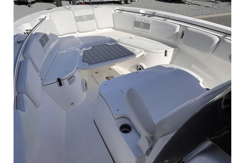 Slide: The Image of 2024 Sea Fox 288 Commander boat interior with spacious seating and storage compartments. - 10