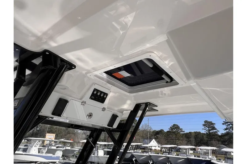 Slide: The Image of 2024 Sea Fox 288 Commander boat interior roof with hatch and control panel. - 12