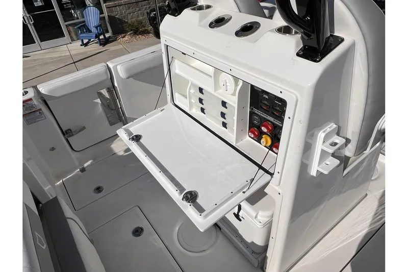 Slide: The Image of 2024 Sea Fox 288 Commander boat console with open storage compartment. - 13