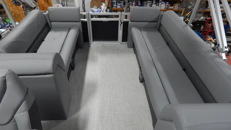 Slide: The Image of 2024 Avalon VLS Quad Lounge 21' interior with gray seating and spacious layout. - 4