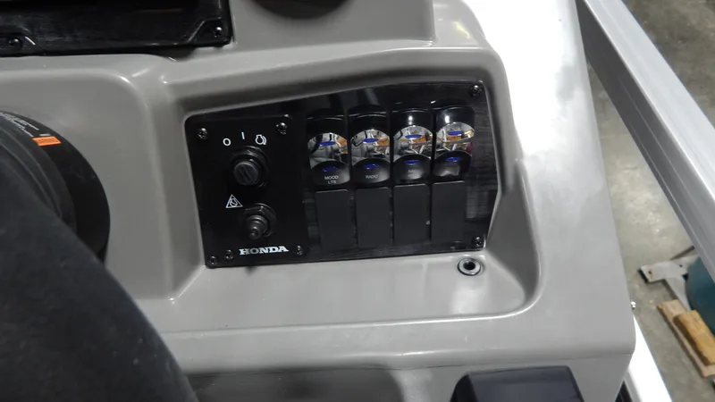 Slide: The Image of Control panel of 2024 Avalon VLS Quad Lounge 21' boat with Honda switches. - 6
