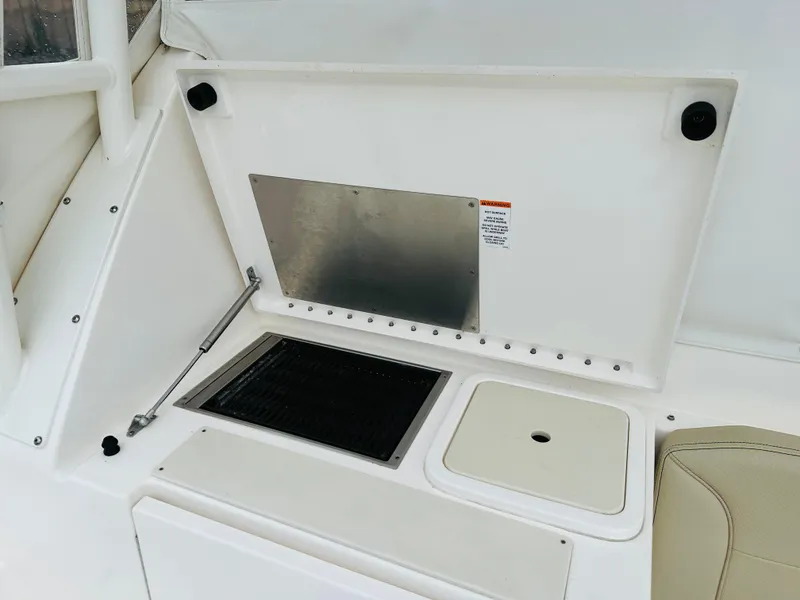 Slide: The Image of 2017 Pursuit OS 355 boat with built-in grill and sink in cockpit area. - 11