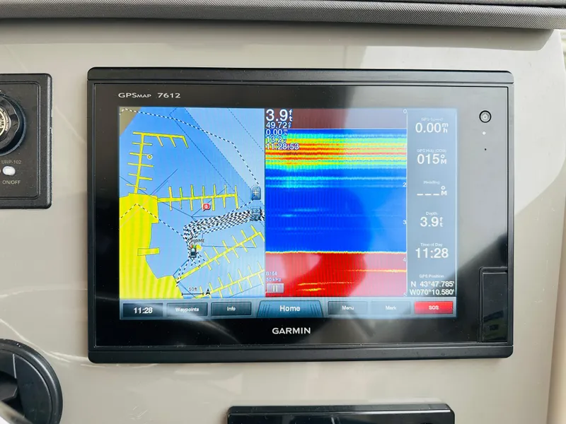Slide: The Image of Garmin GPSMAP 7612 display on 2017 Pursuit OS 355 boat showing navigation and sonar data. - 21