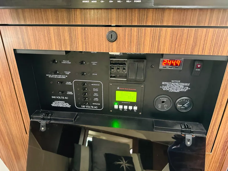 Slide: The Image of Control panel of a 2017 Pursuit OS 355 boat with digital display. - 43
