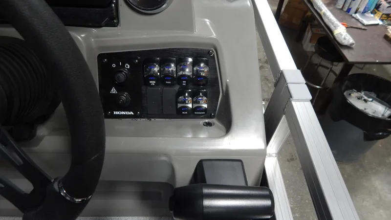 Slide: The Image of Control panel of 2024 Avalon Venture Quad Lounge Tritoon boat. - 11