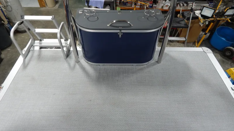 Slide: The Image of 2024 Avalon Venture Quad Lounge Tritoon deck with ladder and storage compartment. - 3