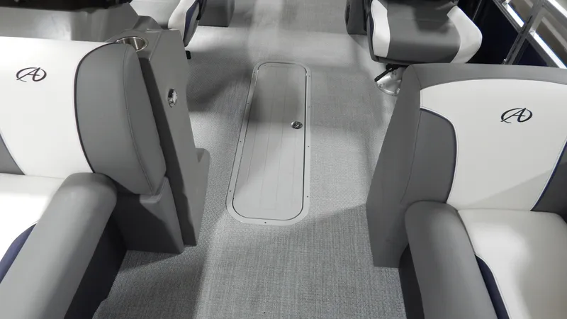 Slide: The Image of 2024 Avalon Venture Quad Lounge Tritoon interior with gray and white seating. - 9