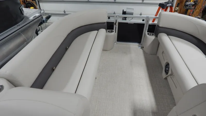 Slide: The Image of 2024 Avalon VLS Quad Lounge 23' interior with beige and gray seating. - 5