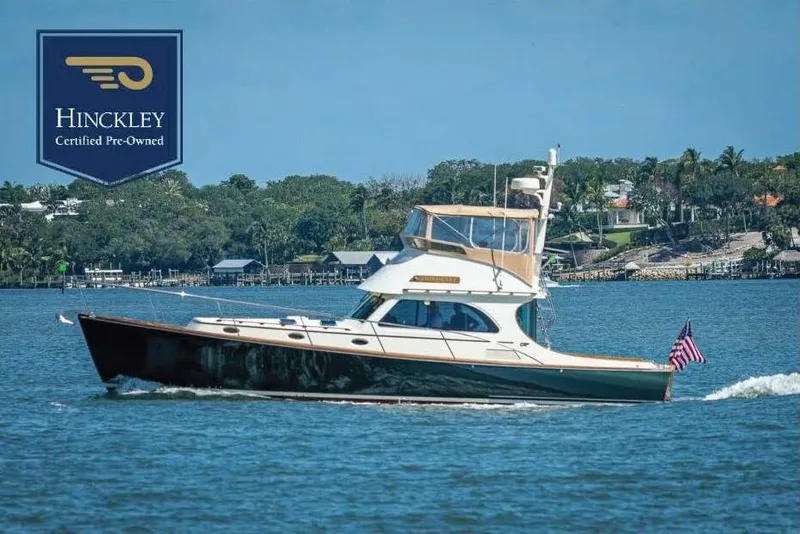 The Image of 2008 Hinckley Talaria 44 FB yacht cruising on a sunny day, certified pre-owned. - 0