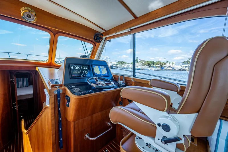 Slide: The Image of 2008 Hinckley Talaria 44 FB helm with leather seating and navigation controls. - 13