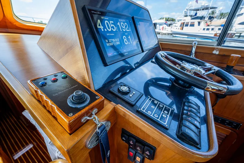 Slide: The Image of Helm of 2008 Hinckley Talaria 44 FB yacht with navigation controls and display. - 14