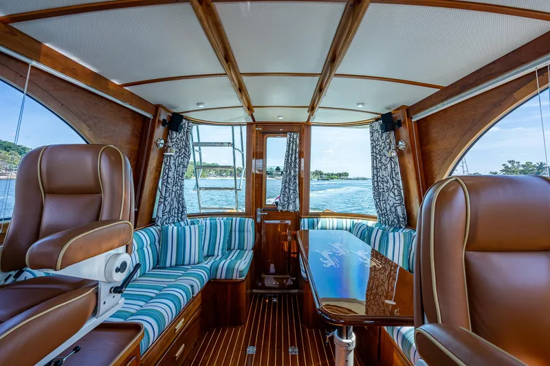 Slide: The Image of Interior of 2008 Hinckley Talaria 44 FB yacht with elegant seating and wooden finishes. - 18