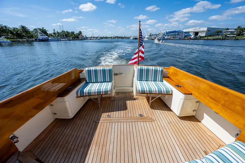 Slide: The Image of Hinckley Talaria 44 FB 2008 yacht deck with striped seating, cruising on a sunny day. - 24