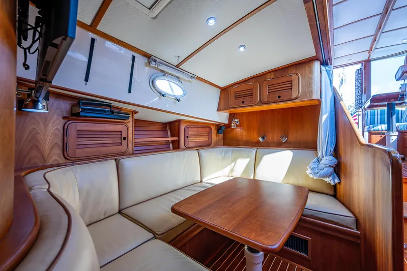 Slide: The Image of Luxurious interior of 2008 Hinckley Talaria 44 FB yacht with wood finish and seating area. - 27