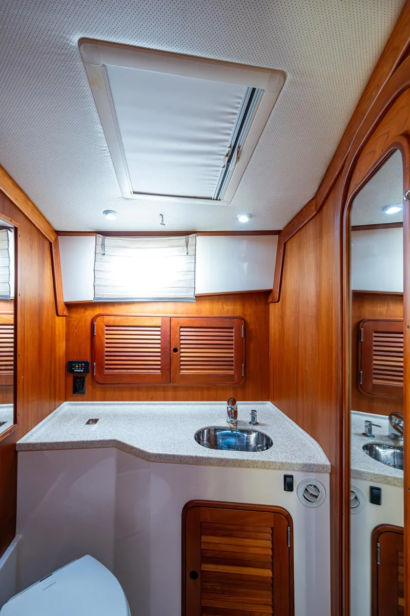 Slide: The Image of Luxurious 2008 Hinckley Talaria 44 FB yacht bathroom with wood accents and modern fixtures. - 31