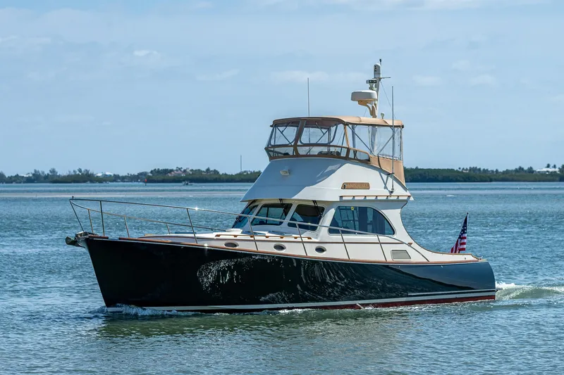 Slide: The Image of 2008 Hinckley Talaria 44 FB yacht cruising on calm waters. - 38