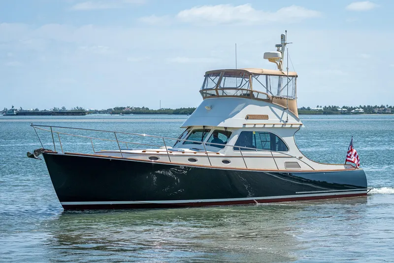 Slide: The Image of 2008 Hinckley Talaria 44 FB yacht cruising on calm waters. - 5