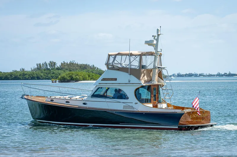Slide: The Image of 2008 Hinckley Talaria 44 FB yacht cruising on calm waters. - 6