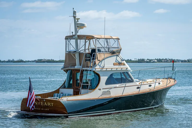 Slide: The Image of 2008 Hinckley Talaria 44 FB yacht cruising on calm waters with clear skies. - 8