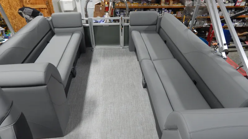 Slide: The Image of 2024 Avalon VLS Quad Lounge 23' interior with gray seating. - 4