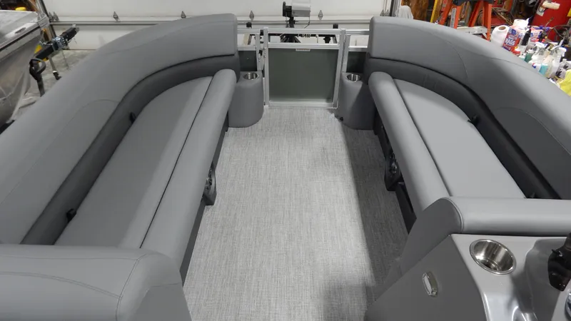 Slide: The Image of 2024 Avalon VLS Quad Lounge 23' interior with gray seating and carpet. - 5