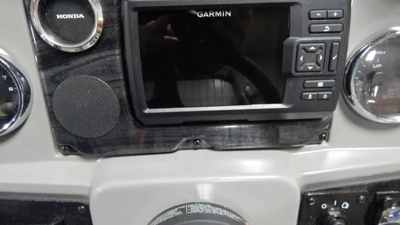 Slide: The Image of 2024 Avalon VLS Quad Lounge 23' dashboard with Garmin navigation system. - 7