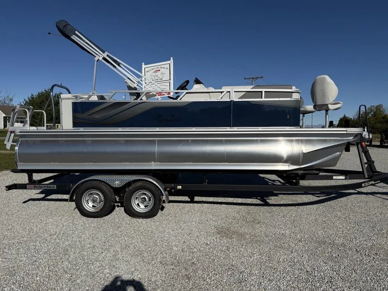 Slide: The Image of 2024 Avalon Venture Cruise Bow Fish 21' pontoon boat on trailer, side view. - 4