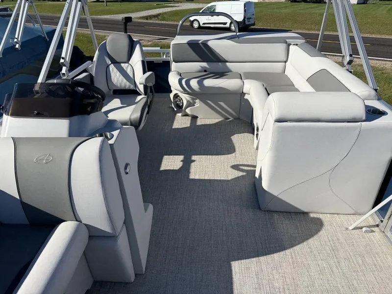 Slide: The Image of 2024 Avalon Venture Cruise Bow Fish boat interior with plush seating and modern design. - 5